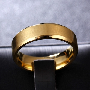 Macro shot of 8mm golden brushed titanium steel ring with polished beveled edges