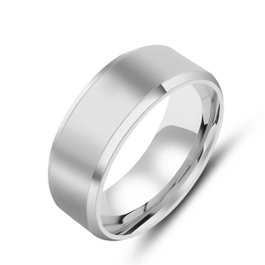 Detailed view of 8mm silver steel ring with polished flat surface and double beveled edges