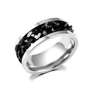 Macro shot of silver titanium steel ring with black chain inlay and polished finish