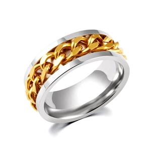 Macro detail of men's stainless steel ring featuring golden Cuban chain inlay