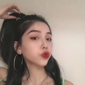 Classic large silver stainless steel hoop earrings for women shown on a model