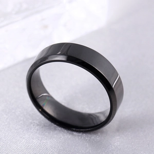 Close-up of 8mm black titanium steel ring with polished beveled edges and mirror finish