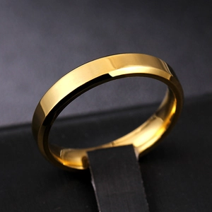 Detailed close-up of 8mm gold beveled edge titanium steel ring with polished finish