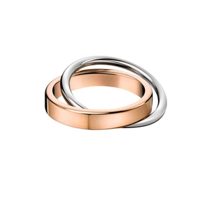 Macro detail of intertwined rose gold and silver bands with mirror polished finish