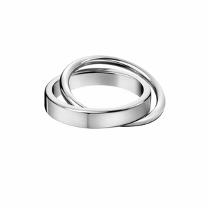 Detail macro view of double interlinked bands in polished 18k silver and gold stainless steel