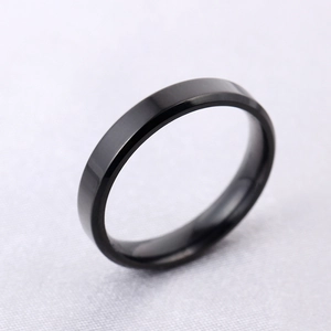 Macro detail of 4mm ultra-thin black titanium steel ring with polished beveled edges