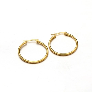 Polished golden stainless steel hoop earrings with classic clasp closure in a minimalist style