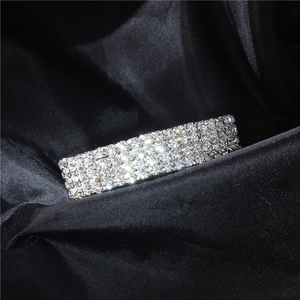 Macro shot of silver bridal bracelet with four rows of sparkling crystal rhinestones