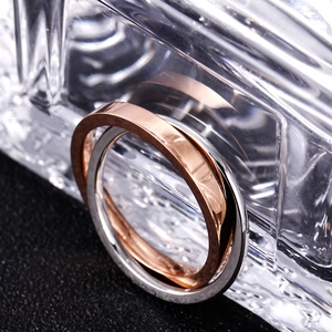 Close-up of polished 18K stainless steel rings in rose gold and silver finish