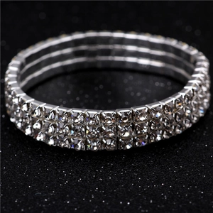 Close-up of three-row crystal stretch bracelet with silver-tone metal and clear rhinestones