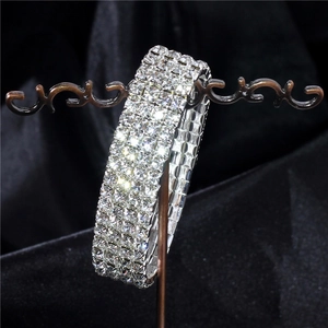 Sparkling four-row crystal elastic bracelet in silver finish for wedding and evening wear