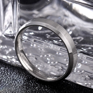 Macro shot of 8mm silver steel ring with brushed finish and polished inner surface