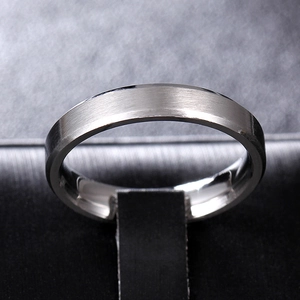 Close-up of 8mm brushed silver-grey titanium steel ring with polished beveled edges
