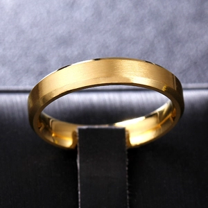 Macro shot of gold ring with a brushed matte finish and polished inner surface