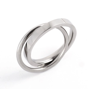 Close-up of interlocking dual-band stainless steel ring with polished silver finish