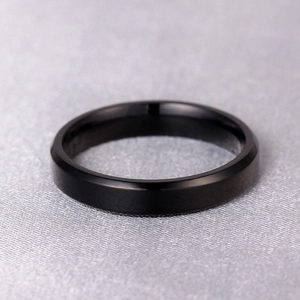 Minimalist 4mm black titanium steel ring with matte brushed finish and beveled edges