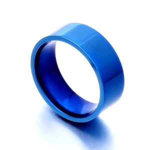 Macro detail of an 8mm polished blue titanium steel ring with smooth metallic finish