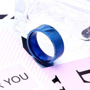 Detail of 8mm flat titanium steel ring with polished deep blue mirror finish