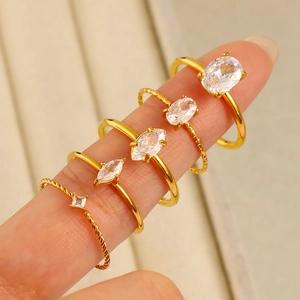 Set of 5 18K gold-plated stainless steel rings with zircon stones on female fingers