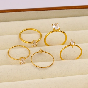 Detail of five-piece 18K gold plated stainless steel rings set with zircon stones
