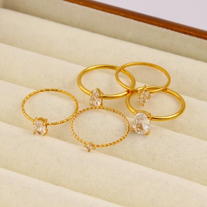Detailed view of 5-piece 18K gold stainless steel ring set with zircon stones