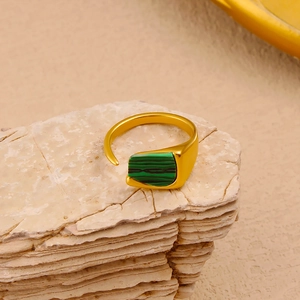 Macro shot of 18K gold plated stainless steel ring with green malachite stone inlay