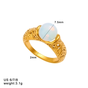 Detail view of 18K gold plated ring with baroque filigree and 7.5mm opal-like gemstone