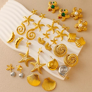 Ocean series earrings set with gold starfish shell designs and faux pearl accents