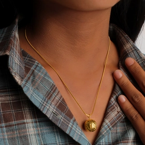 18K gold plated stainless steel pumpkin pendant necklace worn by a fashion model
