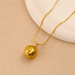 Detail of 18K gold plated stainless steel snake chain necklace with textured ball pendant