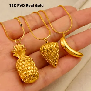 Handheld view of 18K gold plated pineapple strawberry banana fruit pendant necklaces