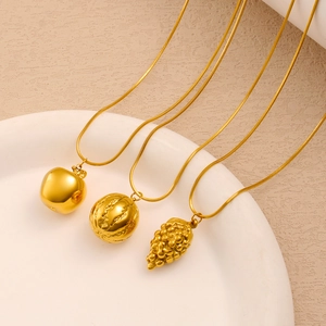 Detailed view of gold stainless steel necklaces with apple, melon, and grape pendants