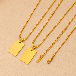 Collana a sfere in acciaio placcato oro 18K con ciondolo quadrato THE WORLD IS YOURS unisex