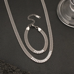 Detail of K18 mesh chain jewelry set featuring baguette-cut cubic zirconia in silver