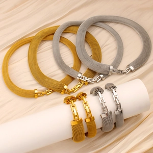 Elegant 18K gold and silver mesh necklace and bracelet set with geometric H-shaped clasps
