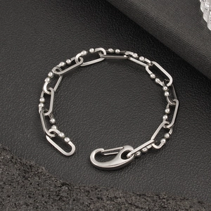 Detail of silver stainless steel chain with industrial spring carabiner clasp lock