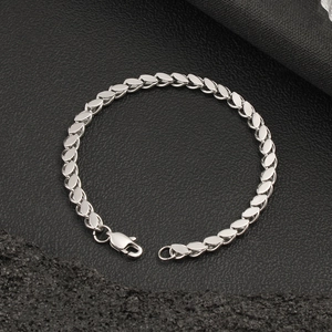 Detailed macro view of the polished stainless steel interlocking chain and lobster clasp