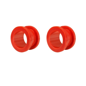 Macro shot of red acrylic double flare ear tunnels with smooth polished surface and glossy finish