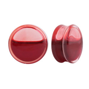 Clear ear plugs pair with flowing red liquid inside on white background