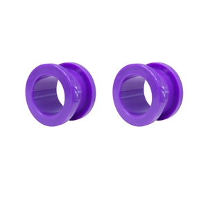 Detailed view of deep purple acrylic saddle ear gauges with polished shiny surface finish