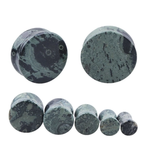 Set of green stone ear plugs with natural marble texture in various sizes for gauges