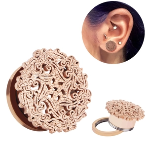 Rose gold stainless steel ear tunnel with matte hollow filigree and screw-on mechanism