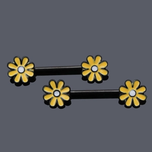 Detail of flower nipple rings featuring yellow daisy enamel on stainless steel barbells