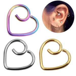 Minimalist heart-shaped piercing earrings in iridescent, silver, and gold steel finishes