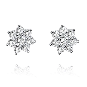 Macro shot of silver flower earrings featuring seven sparkling round cut crystals