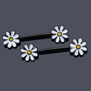 Close-up of two black stainless steel nipple rings with white and yellow daisy flower ends