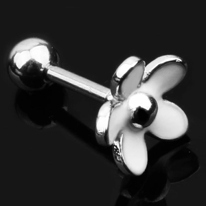 Macro shot of a minimalist white daisy flower cartilage earring on a black surface