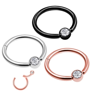 Detailed view of hinged nose rings in black, silver, and rose gold with zircon stones
