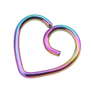 Detailed macro view of heart-shaped iridescent piercing ring with metallic gradient finish