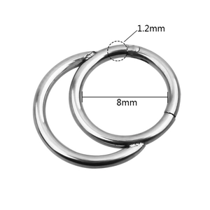 Silver metal piercing ring detail showing 8mm inner diameter and 1.2mm wire thickness